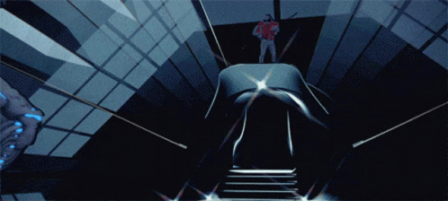a woman walks up stairs in front of an alien scene