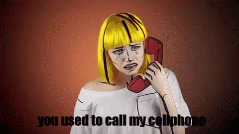 a girl with blue hair using a telephone