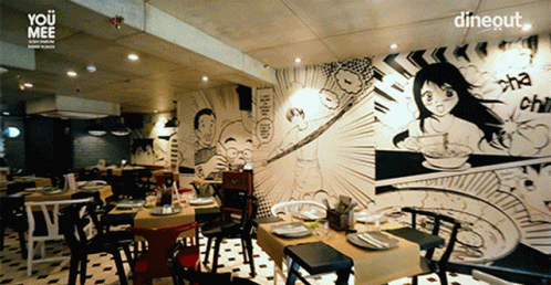 a restaurant with graffiti walls and chairs