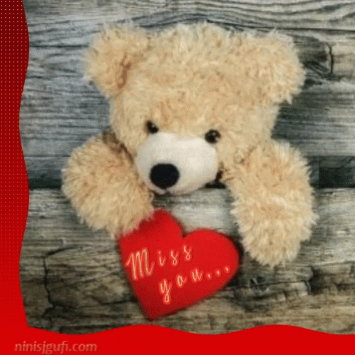 a blue teddy bear with his head on the back of a stuffed heart