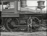 an old black and white po of a train engine