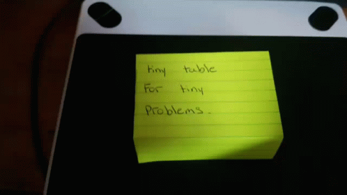 a sticky note written on top of a keyboard