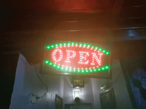 the word open is glowing in the dark