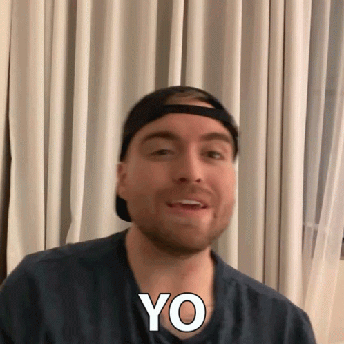 a man wearing headband with the word yo on his face