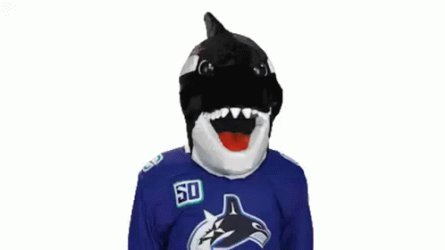 a hockey player is posing for a picture with his face painted like a shark