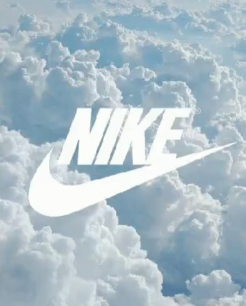 the nike logo is above some white clouds