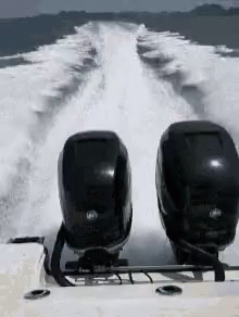 two ski poles sitting in front of a motor boat