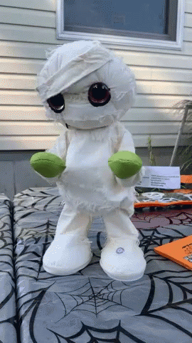 an image of a toy with a white outfit