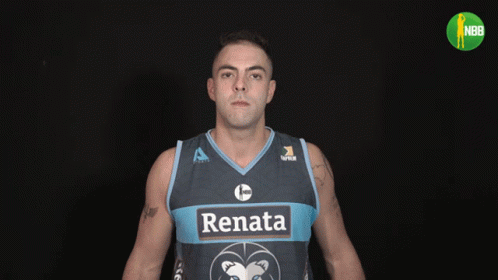 a man with face makeup painted as an afl basketball player