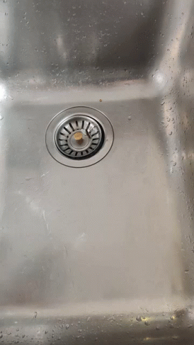 the front of a stainless steel sink that is very dirty