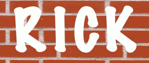 a close up of a brick wall with white letters
