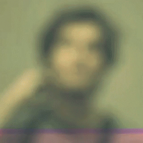 a blurry image of a person's face in the background