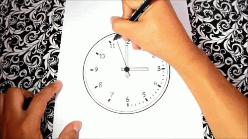 a person with blue hand on paper holding a pen and pointing it to an analog clock