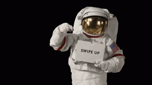 an astronaut is wearing a suit and holding up a sign that says swipe up