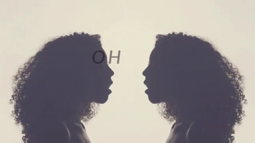 two women facing each other with the words ho written on their faces