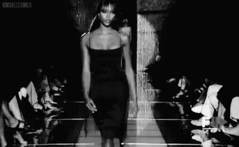 an image of a woman walking down the runway
