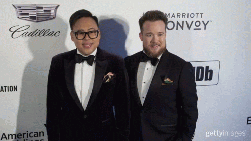 two men in tuxedos at an event