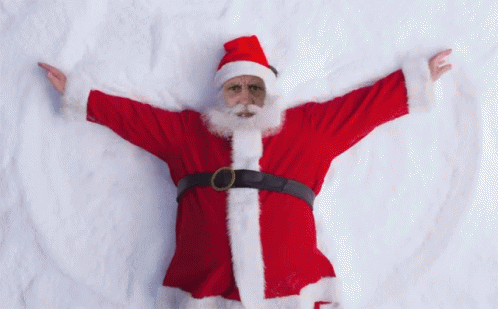 a santa clause holding up his arms in the air