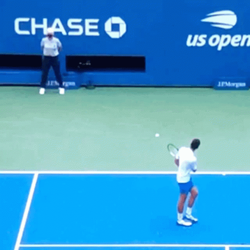 tennis player getting ready to return ball on court