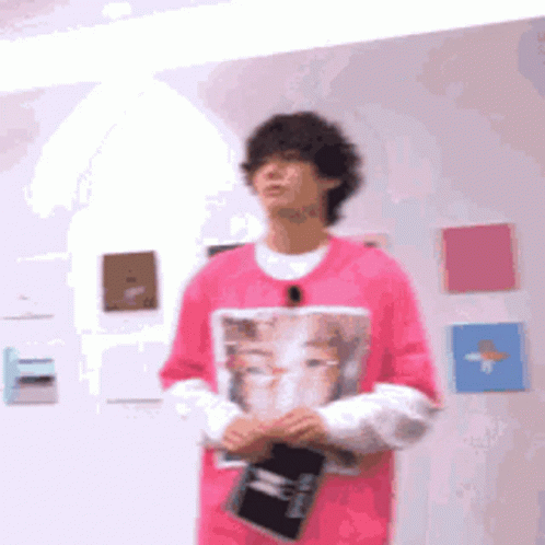 a person wearing a purple shirt in an art gallery