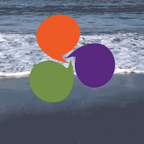 three balloons floating on top of the beach