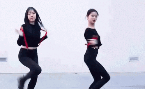 two women wearing black and white doing various dances