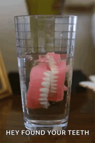 a glass with some toothpaste in it
