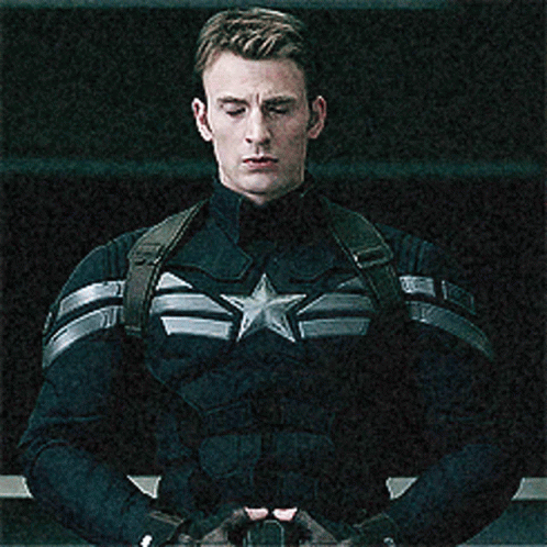 a man in captain america uniform looking off to the side