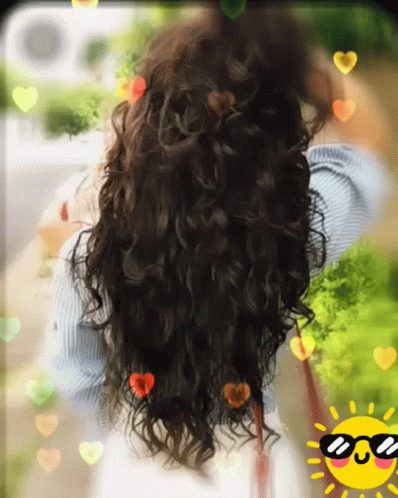 a woman is looking out through a window with lots of hair
