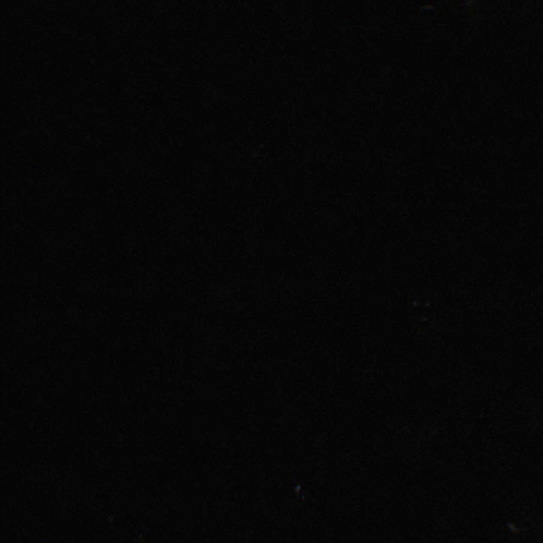 a clock in a dark room at night time