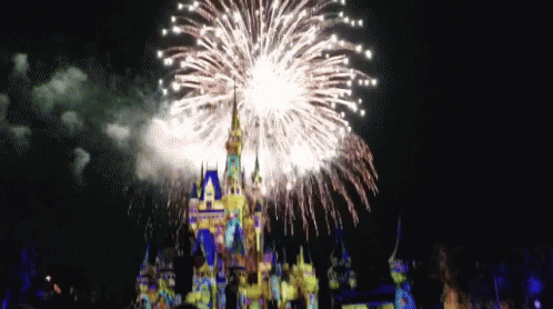 a fireworks display over a castle is shown with its red and blue lights