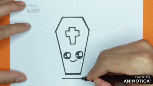 someone using a sharpie to draw a cartoon character