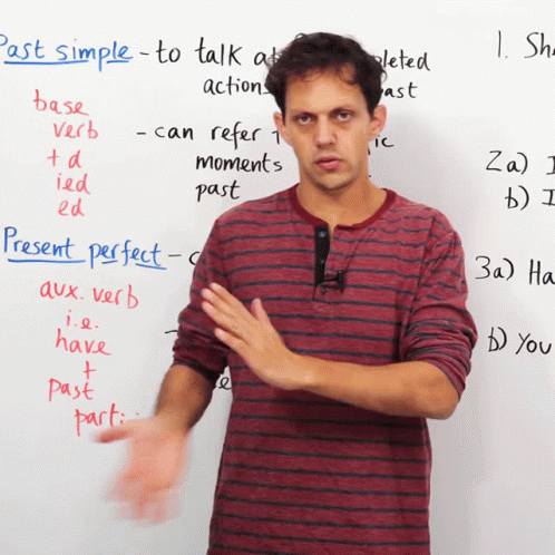 an image of a man standing in front of a white board