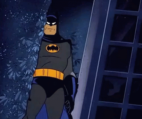 a cartoon of batman standing up in front of a window