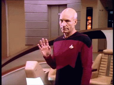star trek character holding his hand out and gesturing