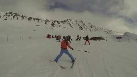 a skier on the top of a mountain