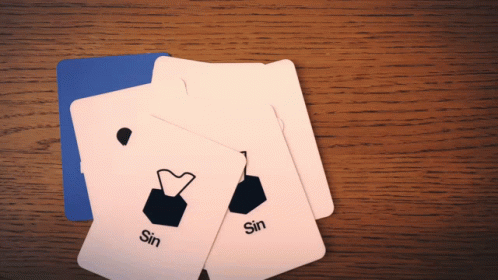 three cards on a blue table in front of the table