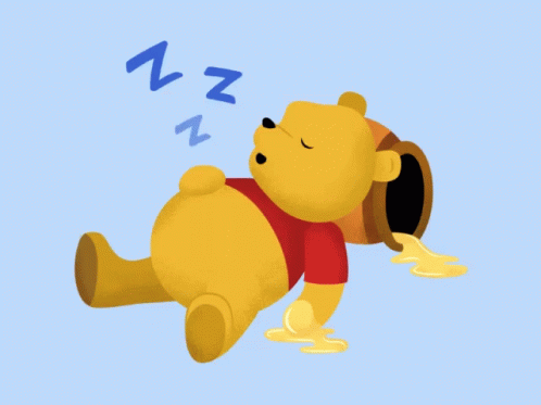 a blue cartoon bear rolling around in a nap