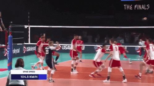 a group of people playing volley ball on a court