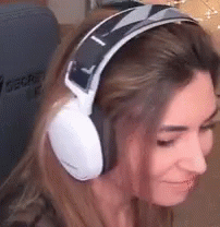 the girl has on headphones to listen music