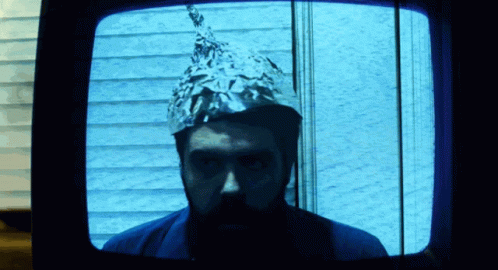 a man with a tinfoil cap and his face covered in duct tape