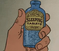 a person holding onto a bottle with sleep pills on it