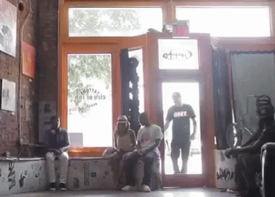 a po of men waiting at an open door