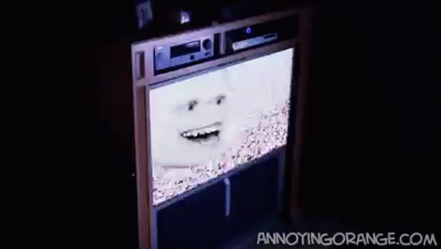 an old tv with a creepy face on it