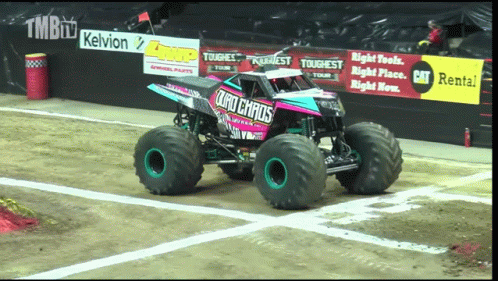 a monster truck is performing a stunt at an event