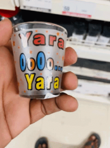 hand holding a coffee cup with the name yara on it