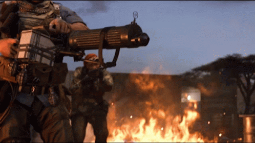 two soldiers in uniform are holding their guns in a fire