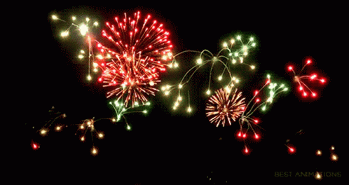 several blue and green firework lights are seen