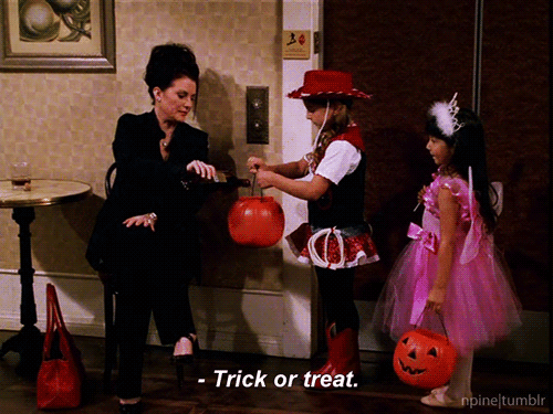 two s wearing halloween costumes with a little girl wearing a witches costume