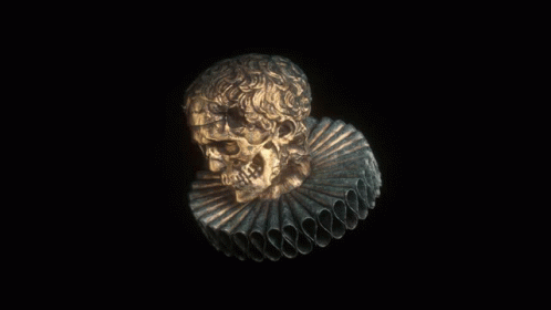 a skull carved into a fan on the black background